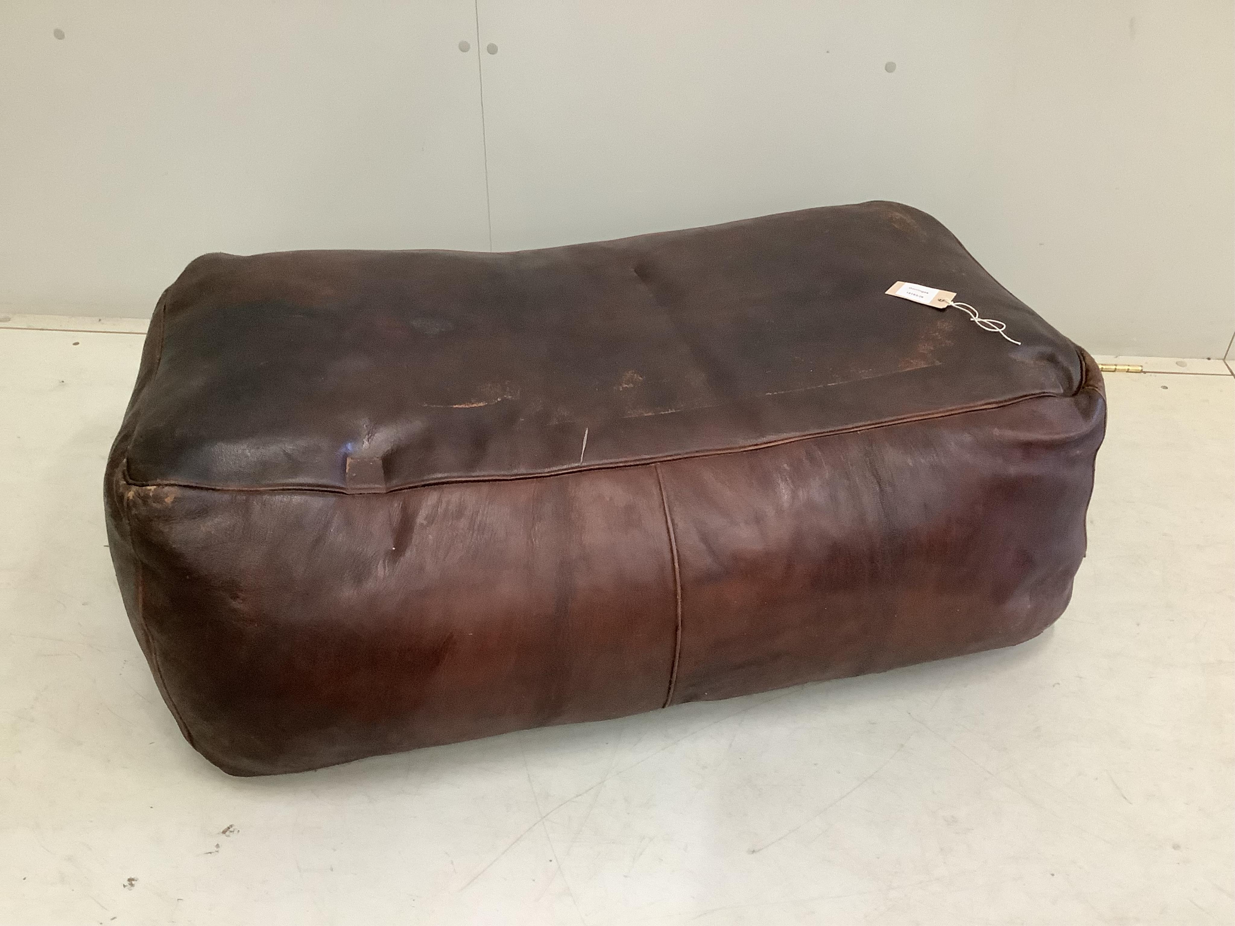 A rectangular leather ottoman, width 105cm, depth 60cm, height 35cm